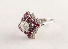 WHITE GOLD, DIAMOND AND RUBY SQUARE CLUSTER RING with a raised centre diamond claw set,