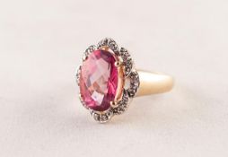 14ct GOLD RING SET WITH A LARGE ROSE CUT, OVAL, WINE RED TOPAZ, a white gold surround of eight