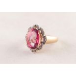 14ct GOLD RING SET WITH A LARGE ROSE CUT, OVAL, WINE RED TOPAZ, a white gold surround of eight