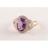 GOLD AND WHITE GOLD COLOURED METAL RING set with an oval amethyst and surround of tiny diamonds