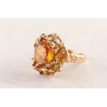 9ct GOLD DRESS RING set with an oval citrine, in an irregular textured rustic surround and