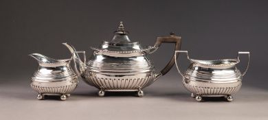EDWARD VII THREE PIECE SILVER TEA SET BY PEARCE & SONS, of part fluted, rounded oblong form with