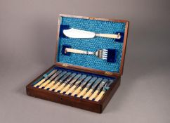 TWELVE PAIR J.W. & Co. EARLY 20th CENTURY ELECTROPLATE FISH EATERS AND MATCHING SERVERS, with