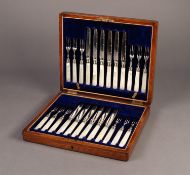 OAK CASE CONTAINING A SET OF 12 FRUIT KNIVES AND 12 FRUIT FORKS with engraved silver plated