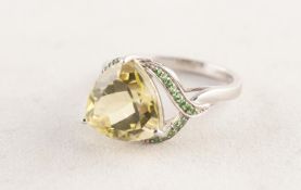 9ct WHITE GOLD DRESS RING set with a large heart shaped peridot, the 'V' shaped shoulders set with