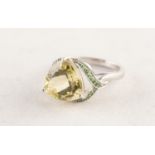 9ct WHITE GOLD DRESS RING set with a large heart shaped peridot, the 'V' shaped shoulders set with