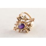 9ct GOLD AND AMETHYST DRESS RING collet set with an oval amethyst in an elaborate diamond shaped