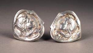 PAIR OF EDWARDIAN SILVER BROOCHES, each embossed with an Art Nouveau female head with scrolling