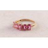 9ct GOLD RING claw set with a row of uniform oval pink stones, 2gms, ring size P