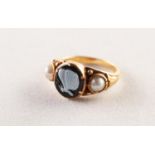 VICTORIAN GOLD MOURNING RING, the centre set with an oval onyx carved with a white butterfly on