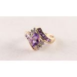 9ct GOLD, AMEHTYST AND DIAMOND CROSS-OVER RING set with a centre oval amethyst and twelve tiny