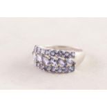 9ct WHITE GOLD RING with a row of six diagonally set lozenge shaped amethysts between two rows