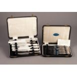 TWO MATCHING CASED SETS OF SIX AFTERNOON TEA KNIVES WITH FILLED QUEENS PATTERN HANDLES, (2)