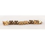 9ct GOLD CHAIN BRACELET with fancy 'C' scroll, circle dual strap links, 3/8in (1cm) wide, 8 3/4in (