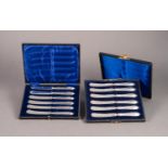 BOXED SET OF SIX AFTERNOON TEA KNIVES with floral embossed pointed silver handles, Sheffield 1915