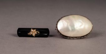 VICTORIAN BLACK ONYX OBLONG MOURNING BROOCH applied with a gold leaf set with five seed pearls,