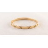 ALDO CIPULLO, FOR CARTIER, CIRCA 1970, 18ct YELLOW GOLD LOVE BRACELET with screw fastening clasp,