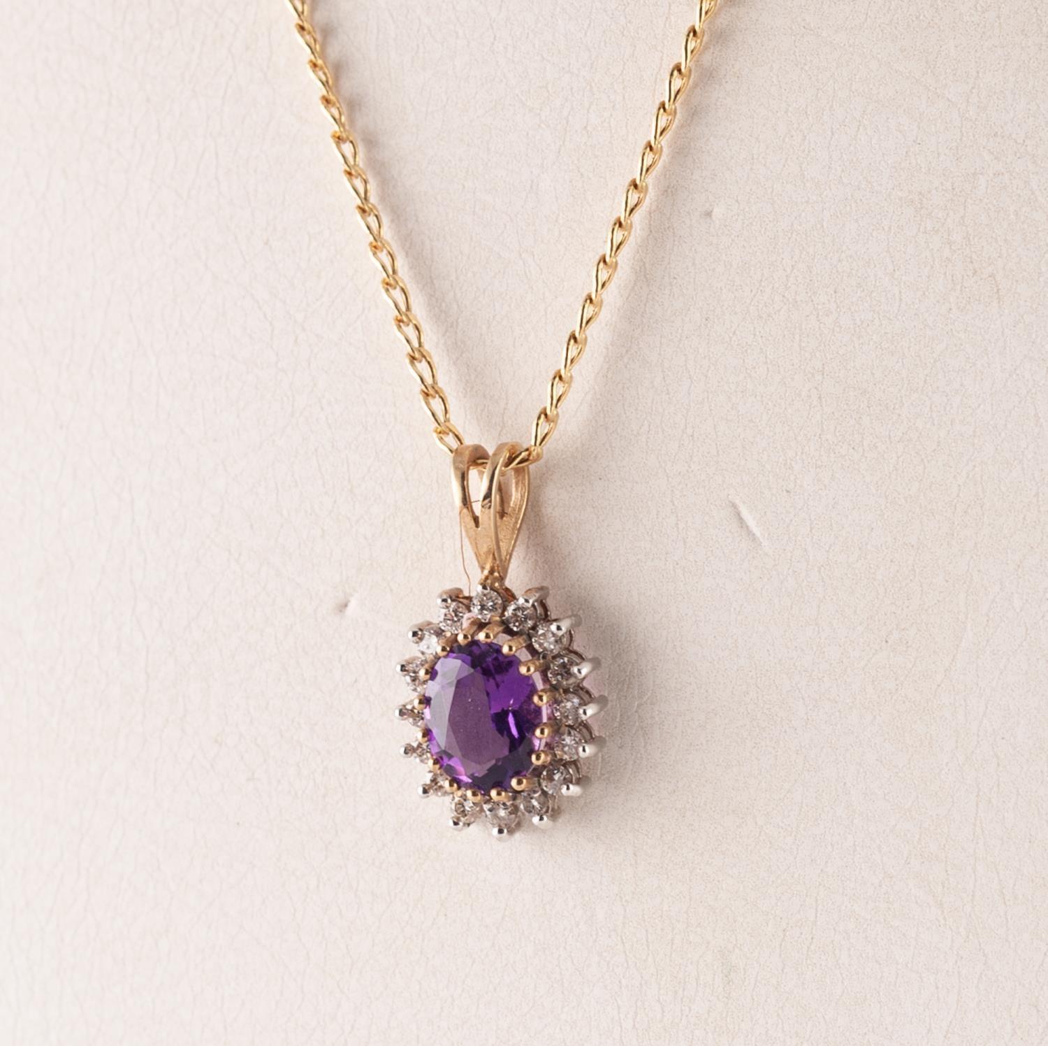 9ct GOLD, AMETHYST AND DIAMOND SMALL OVAL PENDANT, set with a centre oval amethyst and surround of - Image 2 of 2