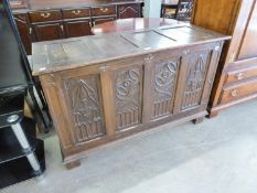 AN EARLY TWENTIETH CENTURY OAK GOTHIC REVIVAL BLANKET CHEST