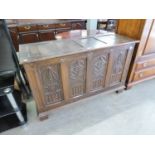 AN EARLY TWENTIETH CENTURY OAK GOTHIC REVIVAL BLANKET CHEST