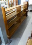 OAK LONG TWO SECTION OPEN BOOK SHELVING HAVING FOUR SHELVES TO EACH SECTION