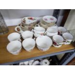 ENGLISH FINE BONE CHINA TEA SET FOR SIX PERSONS, WITH PRINTED DECORATION OF FLORAL SPRAYS, 21 PIECES