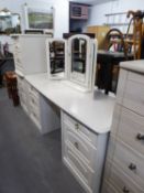 A MODERN WHITE FINISH DOUBLE PEDESTAL DRESSING TABLE WITH TRIPLE MIRRORS AND THE MATCHING TWO DRAWER