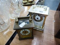 BRASS CARRIAGE CLOCK (THE GLASS IS CRACKED) AND A HESMIE CARRIAGE QUARTZ CLOCK  (2)