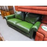 A FULLY UPHOLSTERED GREEN LEATHER THREE SEATER SETTEE (BY SPRINGVALE)