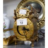 A VINTAGE BRASS SMALL LANTERN CLOCK WITH MAINS ELECTRIC MOVEMENT