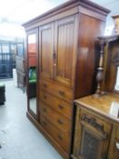 AN EDWARDIAN WALNUT TRIPLE WARDROBE