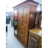 AN EDWARDIAN WALNUT TRIPLE WARDROBE