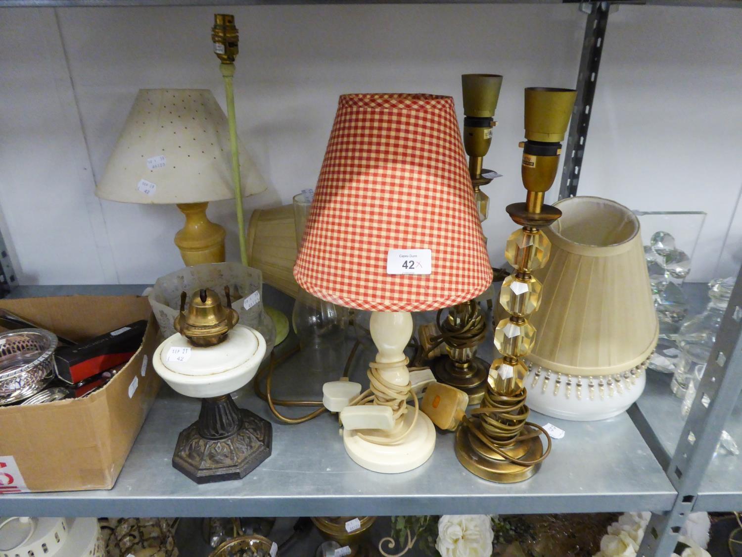 TWO BRASS AND GLASS TABLE LAMPS AND SHADES; A SMALL OIL TABLE LAMP AND SEVEN VARIOUS CANDLE LAMPS