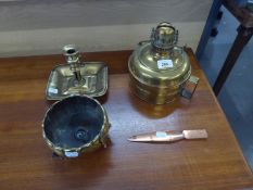 A BRASS OIL LAMP BASE, A BRASS SMALL BOWL RAISED ON THREE FEET, A CHAMBER CANDLE STICK AND A BRONZE
