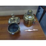 A BRASS OIL LAMP BASE, A BRASS SMALL BOWL RAISED ON THREE FEET, A CHAMBER CANDLE STICK AND A BRONZE