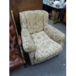 AN EDWARDIAN UPHOLSTERED ARMCHAIR