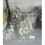 A PAIR OF JULIAN MACDONALD FACETED CUT GLASS BOOKENDS; A FACETED GLASS HEART SHAPED PAPERWEIGHT;