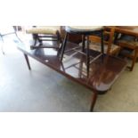 A LARGE OBLONG MAHOGANY COFFEE TABLE WITH QUADRANT CORNERS, ON POST SUPPORTS, 5? X 2?2? , WITH PLATE