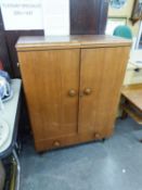 1960?S OAK COCKTAIL BAR/CABINET WITH FOLD-OUT TOP, FITTED INTERIOR, TWO SHORT DRAWERS BELOW, ON TV