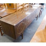 A WOOD-EFFECT MELAMINE LONG, LOW SIDEBOARD WITH THREE CENTRE DRAWERS AND END CUPBOARDS