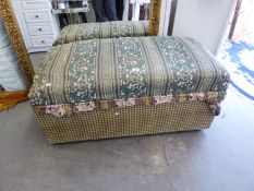 A LARGE UPHOLSTERED BEDDING BOX WITH HINGED LID