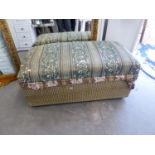 A LARGE UPHOLSTERED BEDDING BOX WITH HINGED LID