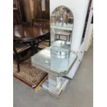 AN ART DECO STYLE MIRRORED GLASS OCCASIONAL TABLE (A.F.) AND AN ART DECO STYLE GLASS WALL MIRROR