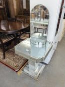 AN ART DECO STYLE MIRRORED GLASS OCCASIONAL TABLE (A.F.) AND AN ART DECO STYLE GLASS WALL MIRROR