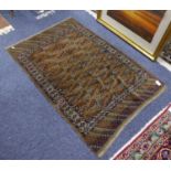 OLD TURKOMAN BOKHARA RUG, with five rows of guls on a faded brown field, white and patterned