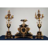 LATE NINETEENTH CENTURY FRENCH GILT METAL MOUNTED BLACK SLATE THREE PIECE CLOCK GARNITURE, the clock