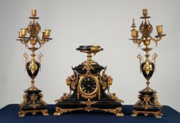 LATE NINETEENTH CENTURY FRENCH GILT METAL MOUNTED BLACK SLATE THREE PIECE CLOCK GARNITURE, the clock