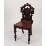 VICTORIAN CARVED MAHOGANY HALL CHAIR, the back outlined with ?C? scrolls and with applied floral