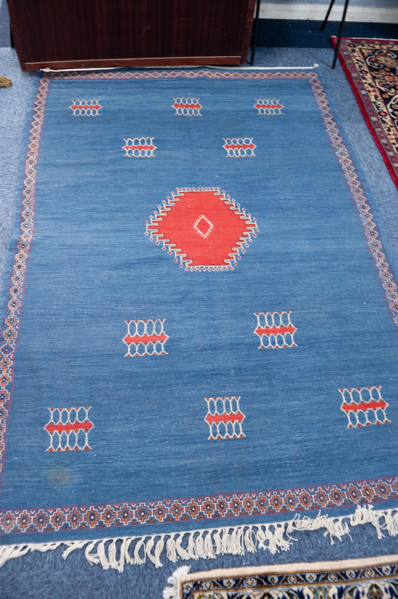 EASTERN KELIM SMALL CARPET, with centre brick red diamond shaped medallion on a plain blue field - Image 2 of 2