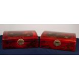 PAIR OF MODERN CHINESE FAUX RED LACQUER PRESENTATION FOUR BOTTLE WINE HOLDERS, each of slightly